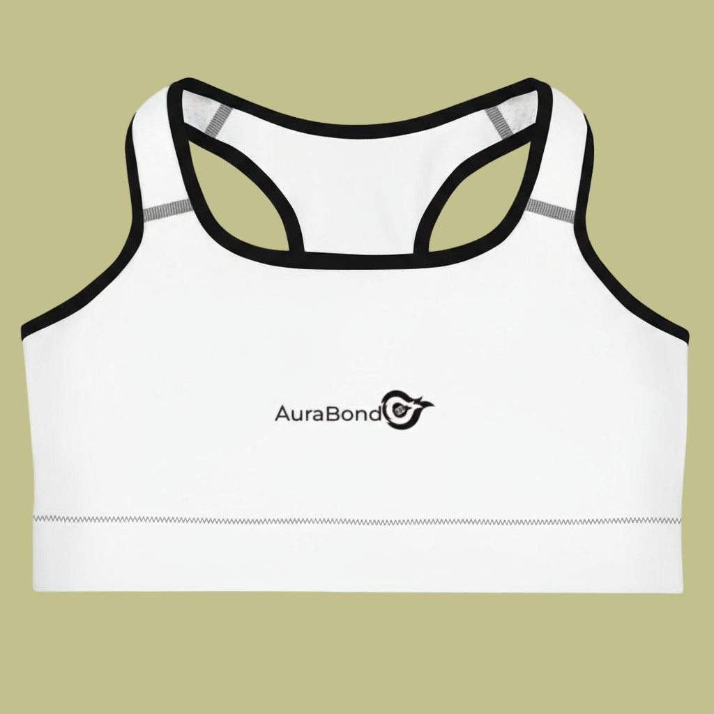 White sports bra with black straps on a beige background, featuring the AuraBond logo.