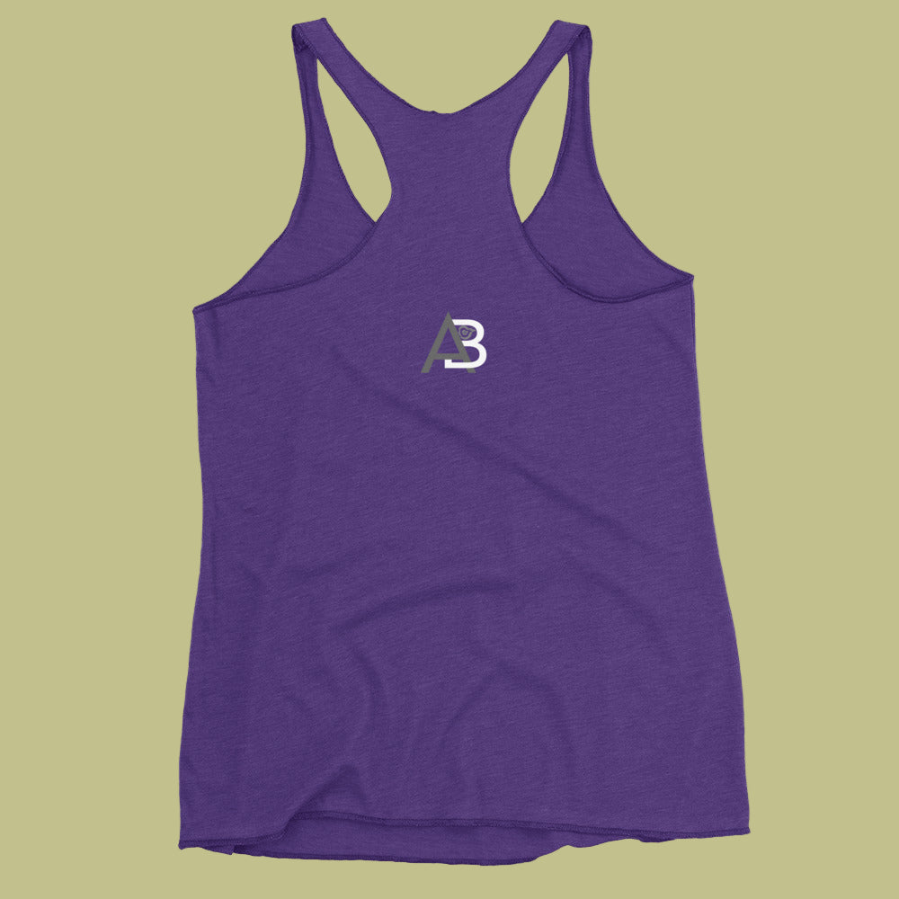 Purple tank top with a logo on a green background