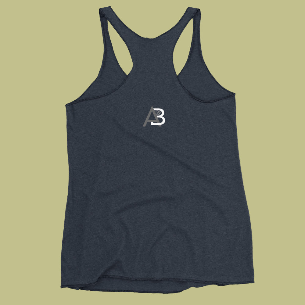 Navy tank top with a logo on the back against a beige background