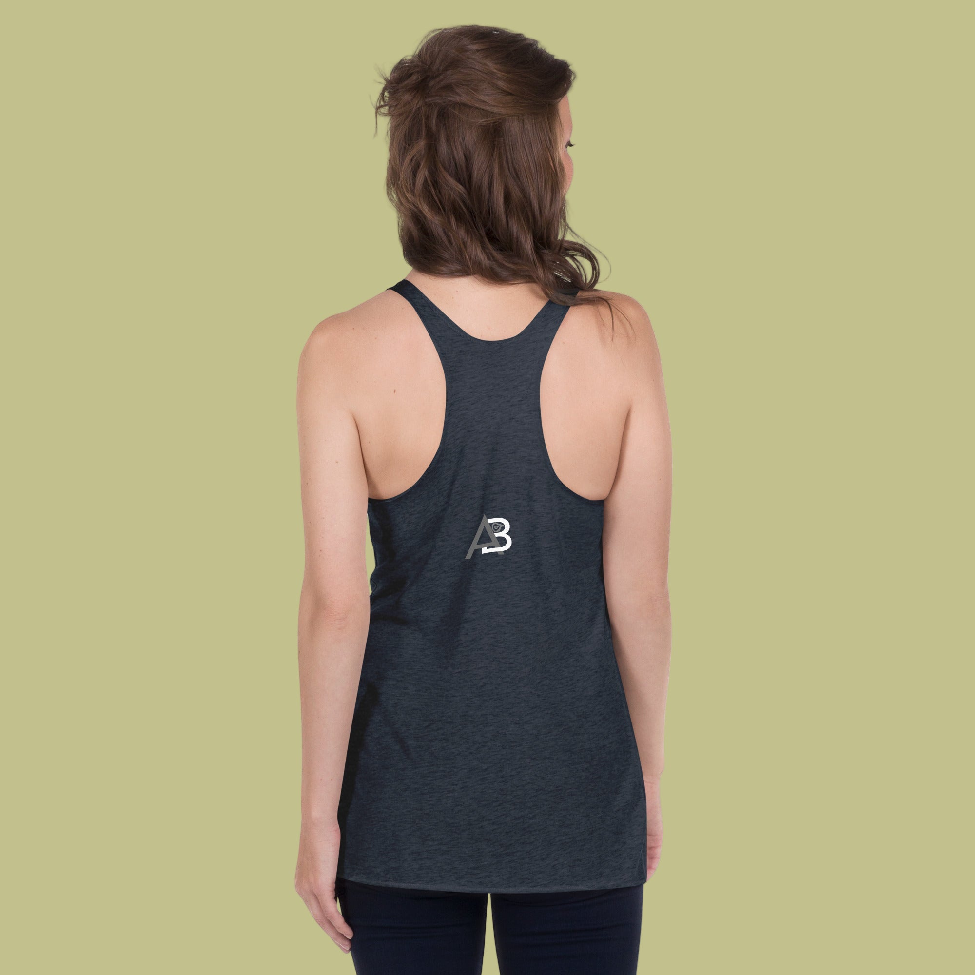 Person wearing a dark blue tank top with a logo on the back against a light green background