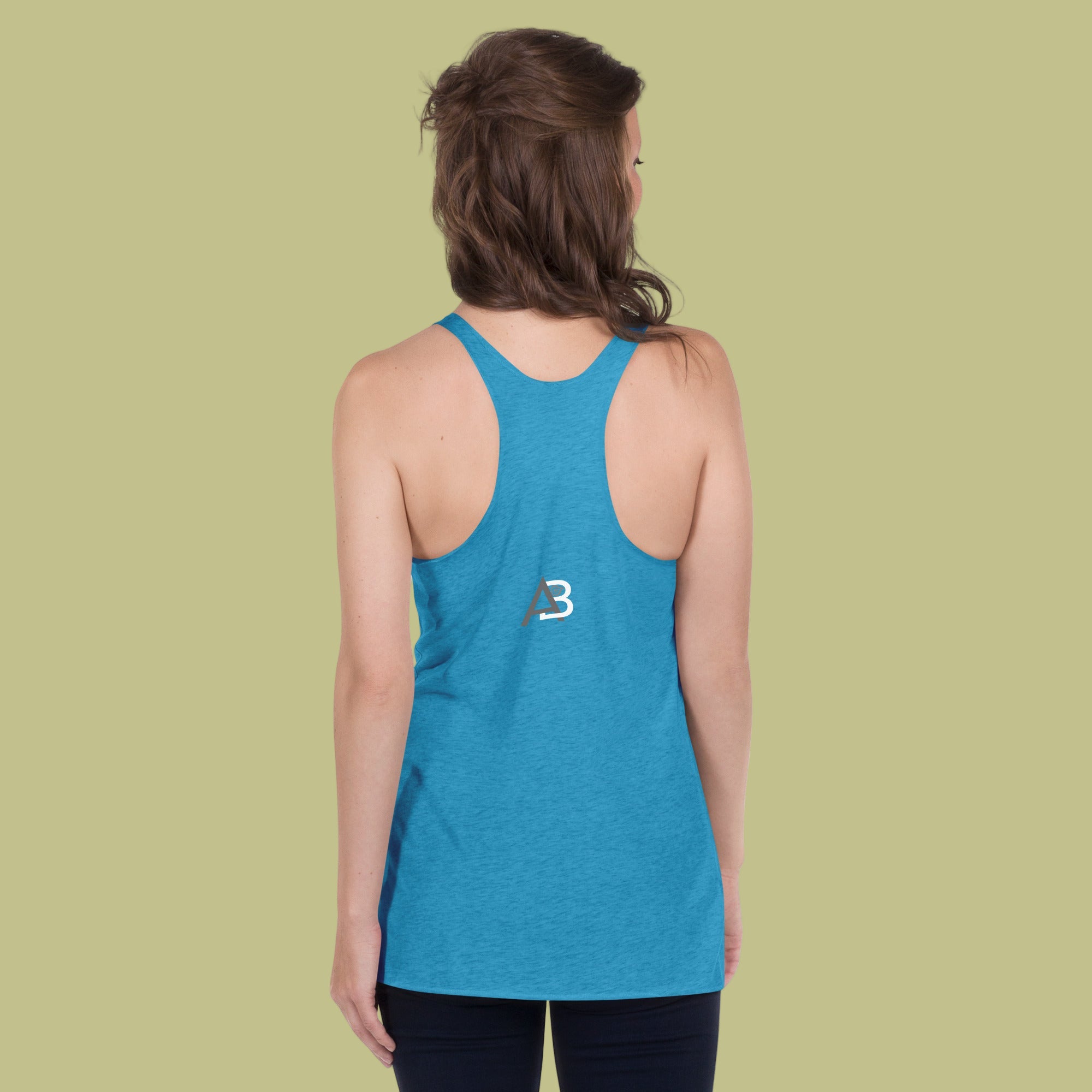 Person wearing a blue tank top with a logo on the back against a green background